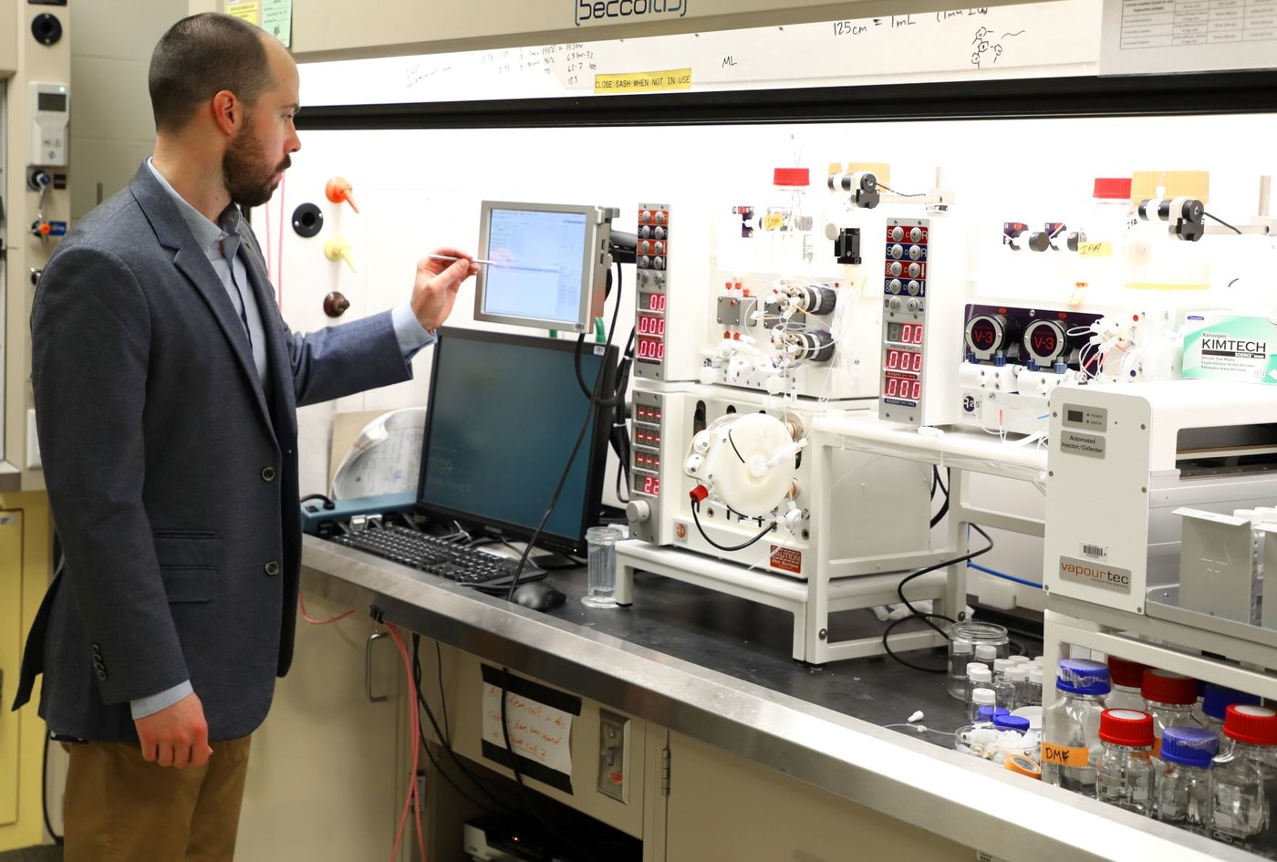 A flow-chemistry machine in operation (U.S. Air Force Research Laboratory with MIT) — continuous synthesis processing; a ChemBioSyn capability brief by Panacea Bio Chem and Bogdan Dicoias